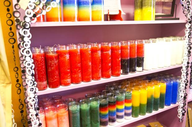 Prayer candles on display at the Psychic Eye Bookstore Silverado ...